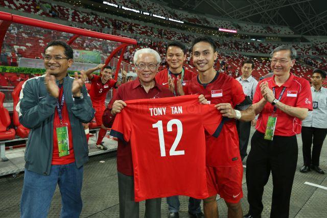 Taken at: ASEAN Football Federation (AFF) Suzuki Cup soccer match (Singapore vs Myanmar) at the National Stadium Sports Hub Pictured: President Tony Tan, Minister of State for Culture, Community and Youth Sam Tan, President of Football Association of Singapore (FAS) Zainudin Nordin and General Secretary of Football Association of Singapore (FAS) Winston Lee