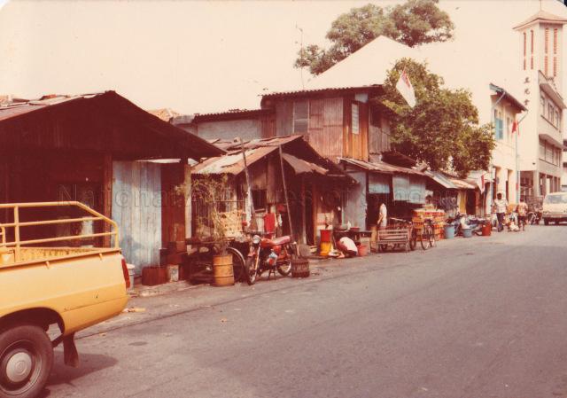 Street scene along Perak Road. Church of True Light with its tower can be seen on the extreme right.