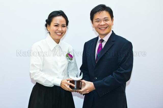Minister for Culture, Community and Youth Lawrence Wong presenting the Young Artist Award to Grace Tan at the 2013 Cultural Medallion and Young Artist Award presentation ceremony