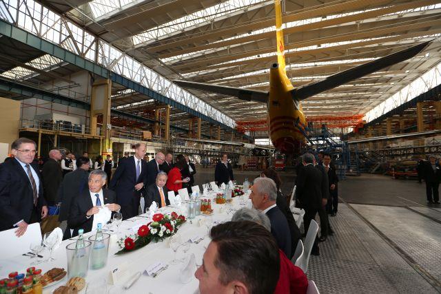 Taken at: Lunch and tour hosted by EADS EFW in an EFW hangar<br />Pictured: Prime Minister Lee Hsien Loong, Minister-President of Saxony Stanislaw Tillich and (on his left) Mdm Ho Ching, wife of PM Lee (back facing camera and in red outfit)