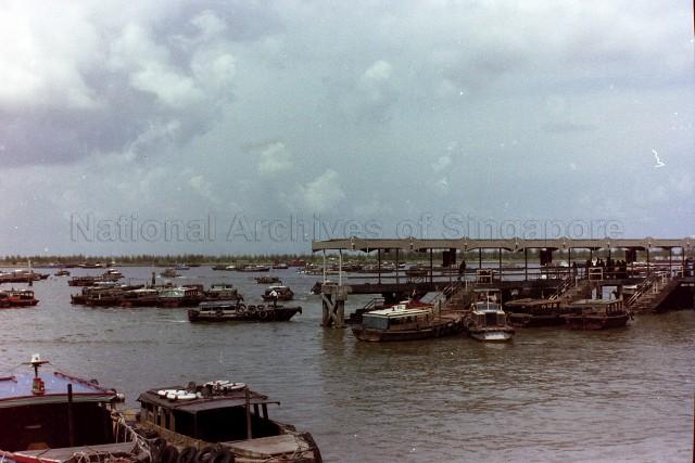 Marina Bay showing a pier with steps leading into the water for passengers to board the Chinese Tongkangs
