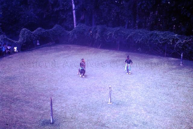 A Kuda Kepang (a Malay folk dance) performed at a traditional Malay wedding held at 2 Cable Road, Singapore, in the late 1960's