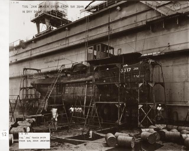 Singapore Naval Base - Tug "Jan" taken over from Sir John Jackson Ltd. In dry dock for repairs.