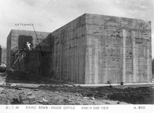 Singapore Naval Base - Rimau bomb-proof office. North end view. The photograph shows the above-ground bomb-proof office at Rimau Offices in the final stages of construction. Rimau Offices would be used as the Rimau Naval Base Police Asian Barracks from the late 1950s until 1971, when the force was disbanded with the withdrawal of British Forces from Singapore  (although families were permitted to live there until early 1972). The complex would be put to use as a branch of Woodbridge Hospital (now IMH), View Road Hospital from 1975 to 2001. The branch was used for the rehabilitative care of long term schizophrenic patients, many of whom were able to work on the premises or in the factories in the area in the day time. It was also used as a foreign workers dormitory on two occasions and is currently unoccupied. The area is slated for redevelopment as part of the Woodlands North development.
