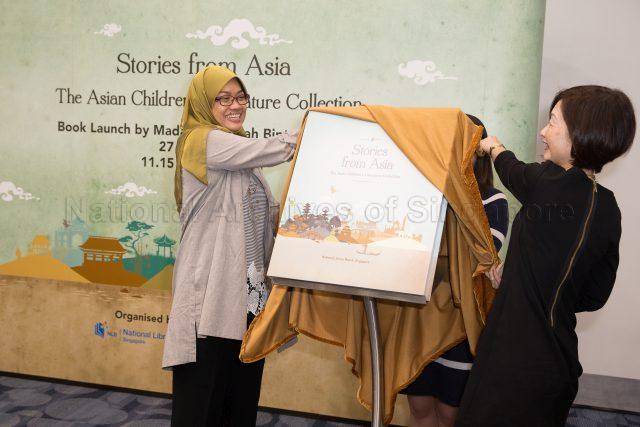 Board Member of National Library Board (NLB) Madam Zuraidah Abdullah and NLB Chief Executive Officer Mrs Elaine Ng unveiling the book â€œStories From Asia: The Asian Children's Literature Collectionâ€ during its launch at National Library Building in Victoria Street