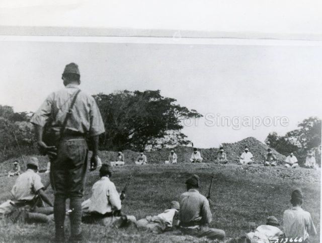 Photograph of Japanese brutality in Singapore. Japanese soldiers preparing to execute blind-folded Sikh prisoners during their occupation.