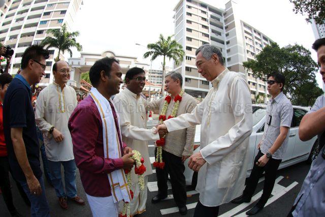 Taken at: Pongal Harvest Festival at Cheng San Community Club Pictured: Prime Minister Lee Hsien Loong, Member of Parliament for Ang Mo Kio GRC Ang Hin Kee and Event Organiser Nadanasigamani Senthil