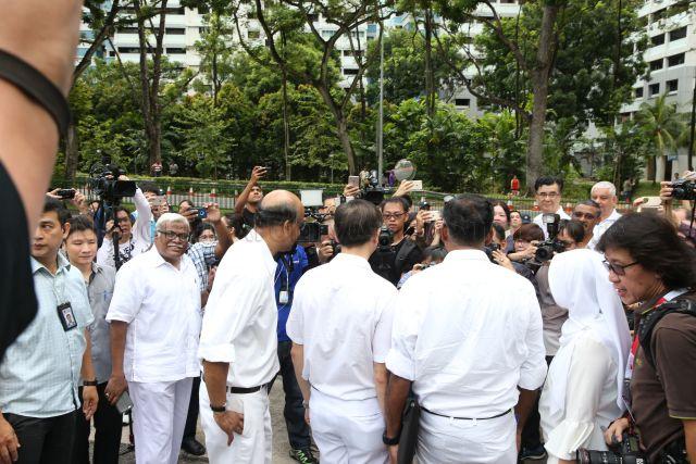 Taken at: Bukit Batok single-member constituency (SMC) by-election between People's Action Party (PAP) and Singapore Democratic Party (SDP) on Nomination Day at Keming Primary School Pictured: Deputy Prime Minister and Coordinating Minister for Economics and Social Policies Tharman Shanmugaratnam, Member of Parliament (MP) for Jurong GRC Rahayu Mahzam (back facing camera), MP for Jurong GRC Ang Wei Neng (back facing camera) and PAP's candidate Murali Pillai (back facing camera)