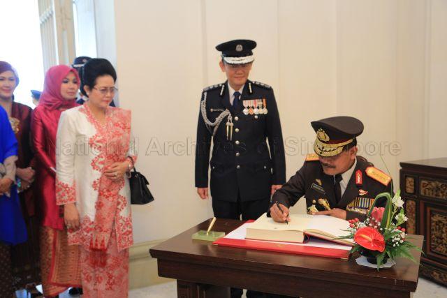 Taken at: Conferment ceremony of Distinguished Service Order on Indonesia's National Police Chief General Badrodin Haiti by President Tony Tan Keng Yam at the Istana Pictured: Indonesia's National Police Chief General Badrodin Haiti and his wife Tejaningsih Haiti, and Commissioner of Police Hoong Wee Teck