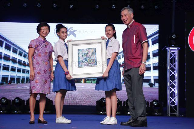 Taken at: The Hua Yi Secondary School 60th Anniversary appreciation dinner at Hua Yi Secondary School Pictured: Prime Minister Lee Hsien Loong and Hua Yi Secondary School Principal Tay Siok Hwa
