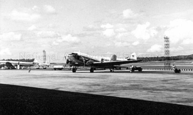 A Malayan Airways DC3 being towed to the hard standing at Paya Lebar