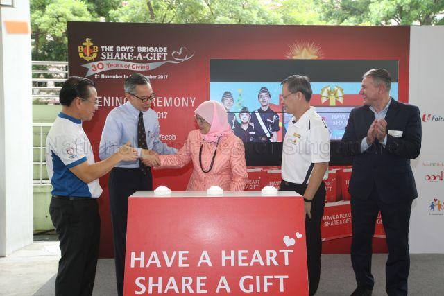 Taken at: Opening ceremony of The Boys' Brigade Share-a-Gift (BBSG) charity drive at Unity Secondary School Pictured: Guest-of-Honour President Halimah Yacob and Member of Parliament (MP) for Marine Parade Group Representation Constituency (GRC) Seah Kian Peng