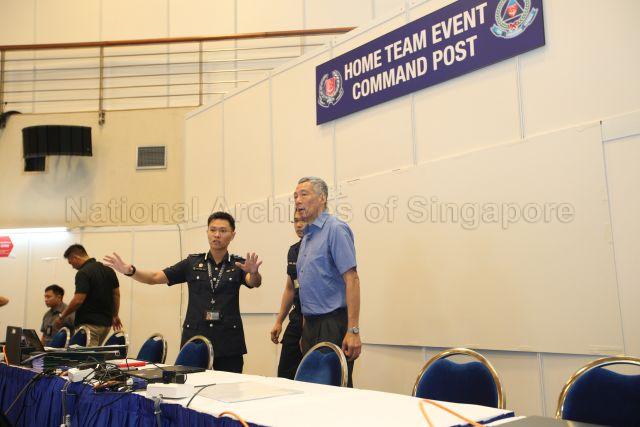 Taken at: Visit to Home Team command post at 28 Irrawaddy Road, behind the scenes at the historic Democratic People's Republic of Korea (DPRK) - United States of America (USA) Singapore Summit &nbsp;Pictured: Prime Minister Lee Hsien Loong, Singapore Police Force Senior Assistant Commissioner How Kwang Hwee and Singapore Civil Defence Force Director of Operations Daniel Seet (partially hidden)