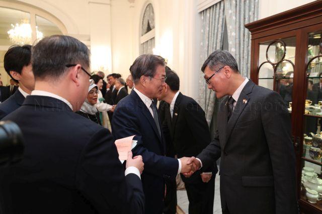 Taken at: State Banquet hosted by President Halimah Yacob and her husband Mohammed Abdullah Alhabshee in honour of His Excellency Moon Jae-ln President of the Republic of Korea accompanied by First Lady Kim Jung-sook at the Istana &nbsp; Pictured: President of the Republic of Korea Moon Jae-In with wife Kim Jung-sook, President Halimah Yacob and Speaker of Parliament Tan Chuan-Jin and Chief Justice of Singapore Sundaresh Menon (partially hidden)