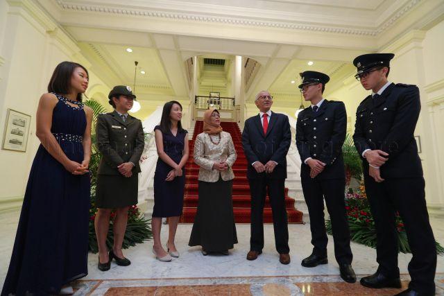 Taken at: President's Scholarship Award ceremony and dinner at the Istana &nbsp;Pictured: President Halimah Yacob and her husband Mohamed Abdullah Alhabshee and President's Scholarship recipients Penny Shi Peng Yi, Tan Xin Hwee, Sharmaine Koh Mingli, Stefan Liew Jing Rui and Alden Tan Ming Yang