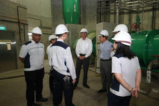 Taken at: Visit to Public Utilities Board (PUB) at Changi Water Reclamation Plant (CWRP) Pictured: Deputy Prime Minister Teo Chee Hean, Chief Executive Officer of PUB Singapore's National Water Agency Ng Joo Hee, Deputy Chief Executive (Operations) Tan Yok Gin and PUB senior engineer Luqman Yang Razali (back facing camera)