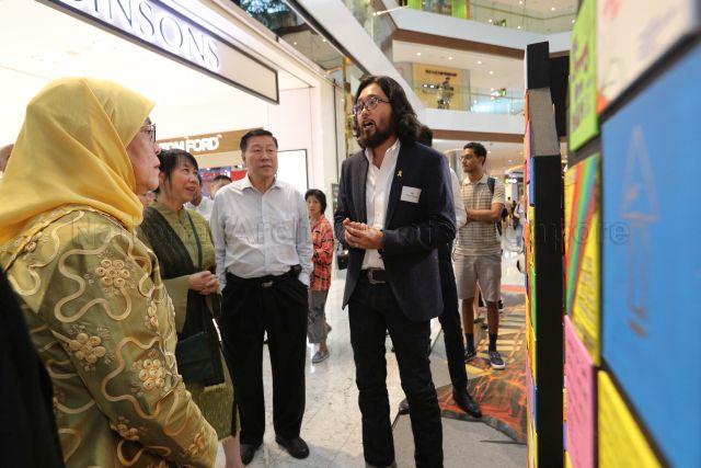 Taken at: Launch of the Yellow Ribbon Community Art Exhibition at Raffles City &nbsp;Pictured: President Halimah Yacob, Singapore Art Museum's Assistant Curator John Tung and Yellow Ribbon Singapore Chairman Chng Hwee Hong