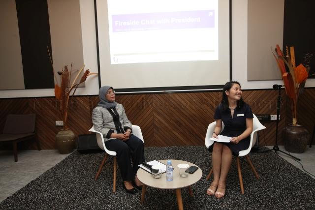 Taken at: Young Women's Leadership Connection (YWLC) session at the Singapore Management University (SMU). Pictured: President Halimah Yacob and YWLC Mentorship Director Goh Xin Ying.