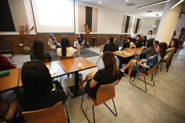Taken at: Young Women's Leadership Connection (YWLC) session at the Singapore Management University (SMU). Pictured: President Halimah Yacob and YWLC Mentorship Director Goh Xin Ying.