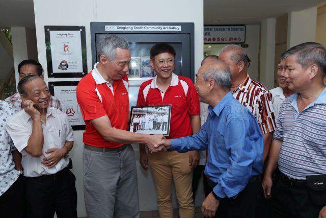 Taken at: Ang Mo Kio (AMK) GRC and Sengkang West (SKW) SMC Family Carnival and Tree Planting Day in front of Block 405A Fernvale Lane in Sengkang  Pictured: Prime Minister Lee Hsien Loong and Member of Parliament for AMK GRC Gan Thiam Poh