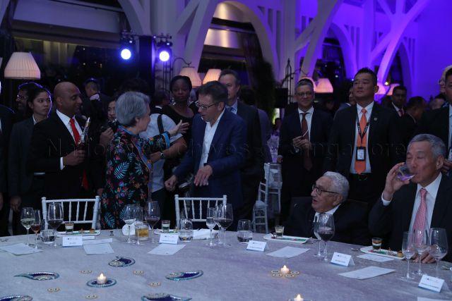 Taken at: Bloomberg New Economy Forum's welcome dinner and dialogue at Clifford Pier @ Fullerton Bay Hotel  Pictured: Prime Minister Lee Hsien Loong and his wife Mdm Ho Ching and former United States Secretary of State Dr Henry Kissinger