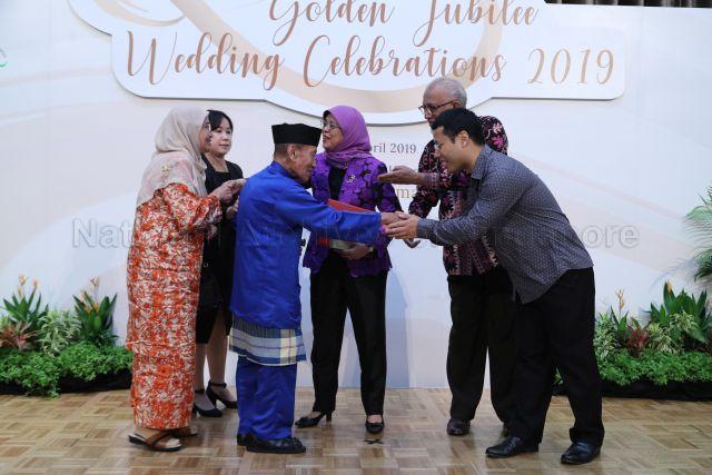 Taken at: Golden Jubilee Wedding Celebrations 2019 at Fairmont Singapore Pictured: Guest-of-Honour President Halimah Yacob, her husband Mohamed Abdullah Alhabshee and Minister for Social and Family Development and Second Minister for National Development Desmond Lee