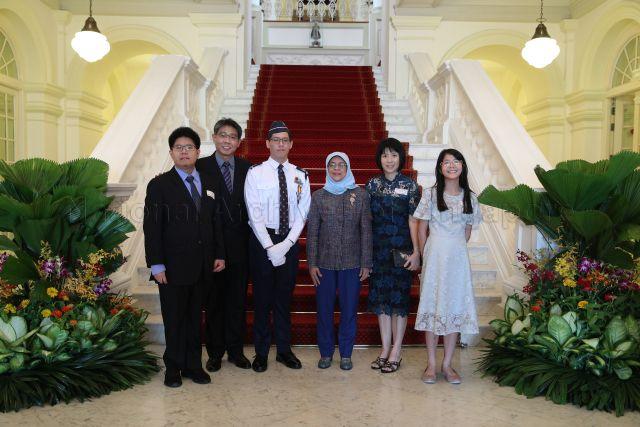 Taken at: Boys' Brigade (BB) President's Award presentation at the Istana Pictured: President Halimah Yacob and President's Award recipient Jason Timothy Pan