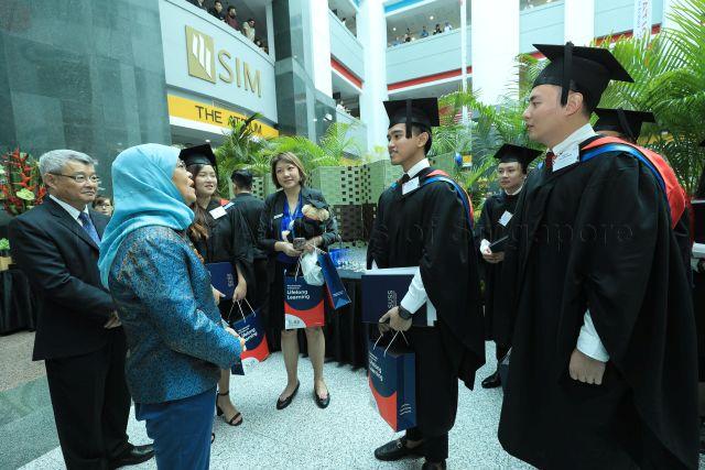 Taken at: Opening Session of SUSS Convocation 2019 themed “Go Make Your Mark” at SUSS Grand Hall Pictured: Patron of SUSS President Halimah Yacob, SUSS-EMP Alumni Entrepreneurship Award Winner and Bachelor of Accountancy recipient Eunice Low Yi Ting, SUSS-EMP Alumni Entrepreneurship Award Winner and Bachelor of Finance recipient Daryl Teo Zhe Wei and SUSS-EMP Alumni Entrepreneurship Award Winner and Bachelor of Science in Marketing with minor in Communications recipient Kaesang Pangarep, son of Indonesian President Joko Widodo