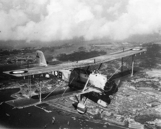 A Vickers Vildebeest Biplane flying over Singapore