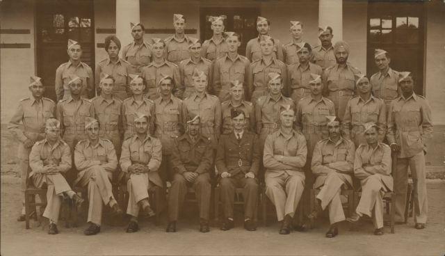 No. 1 Platoon "D" Company, Officer Training School, Bangalore. Captain Mike Gorrie is at front row, seated fourth from right.