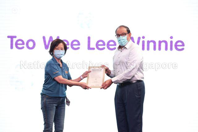 Taken at: Infocomm Media Development Authority (IMDA)'s Partners' Appreciation event held at Suntec City Pictured: Minister for Communications and Information S Iswaran and award recipient Teo Wee Lee Winnie