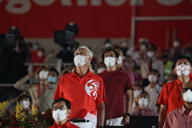 Taken at: National Day Parade (NDP) 2021 ceremonial parade at The Float @ Marina Bay Pictured: Deputy Prime Minister and Coordinating Minister for Economic Policies Heng Swee Keat, Emeritus Senior Minister Goh Chok Tong, Senior Minister and Coordinating Minister for Social Policies Tharman Shanmugaratnam (partially hidden) and Senior Minister for Transport Chee Hong Tat