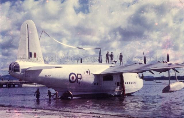 Short Sunderland flying boat, ML797 'P' Papa, of No. 205 Squadron being hauled out of the water for the last time at Royal Air Force (RAF) Seletar. She would be winched up the slipway, stern first past an honour guard who would present arms. The aircraft was flying a paying-off pennant with the 205 Squadron flag (crossed kris) on display. On 14 May 1959, Sunderland DP198 'W' Whisky, made its last maritime operational sortie by escorting HMS Caprice through the Malacca when it was on its way from Ceylon to Singapore. On 15 May 1959, DP198 'W' and ML797 'P' made a farewell flypast over Singapore. On 20 May 1959, ML797 'P' was allotted the honour of making the very last flight of an RAF Sunderland. Both flying boats were struck off charge at Changi on 29 July 1959 and scrapped at the base.