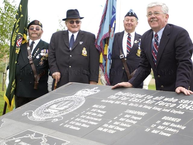 Royal Air Force Seletar Association (RAFSA) members posing behind the FEAF (Far East Air Force) Monument, dedicated to all who served with the FEAF 1949-1971. FEAF Memorial is located at National Memorial Arboretum, Alrewas, U.K.