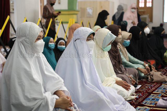 Taken at: Hari Raya Aidilfitri Prayers at Sultan Mosque Pictured: President Halimah Yacob and Parliamentary Secretary for Communications and Information and Health Rahayu Mahzam