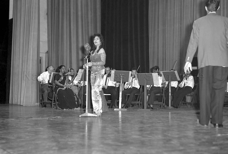 Popular Shaw Brothers' Malay actress/playback singer Rahmah Rahmat performing a song at "Suara Ria Singapura" held at Victoria Theatre. 