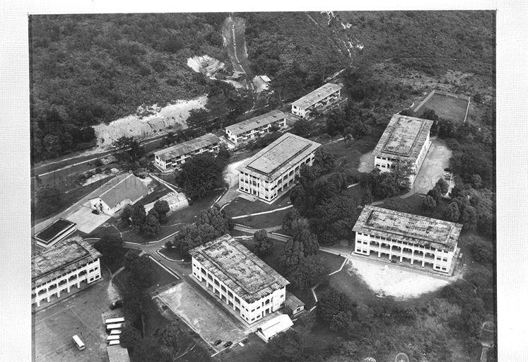 This is an aerial view of the parade square of Gillman Barracks and the barrack blocks arranged around it.