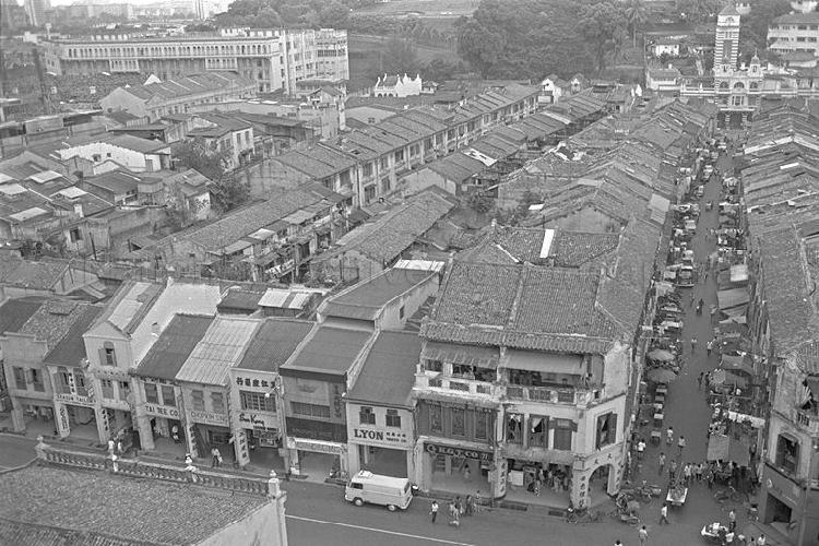 Picture of the Hill Street Police Station (left, background), Central Fire Station (right, background) and rows of shop houses.