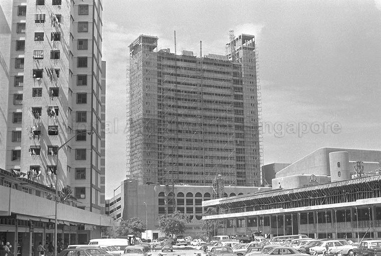 Golden Mile Tower (centre) under construction on Beach Road, with part of Golden Theatre visible on right. Golden Mile Food Centre is being constructed in the foreground.
