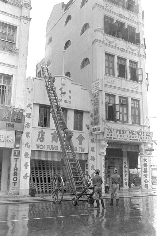 Firefighters putting out fire at 192 South Bridge Road near the vicinity of Chin Chew Street.