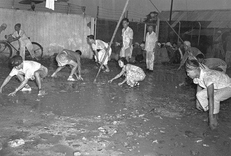 Sympathisers of dismissed Hock Lee busmen throwing stones at