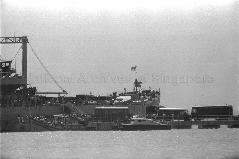 Landing Ship Tank (LST), RSS Resolution, L204, alongside Bedok Jetty to support Operation Thunderstorm. The Vietnamese refugees who landed at Tanjong Rhu in a fishing trawler were provided with fuel and supplies to leave Singapore for another destination.